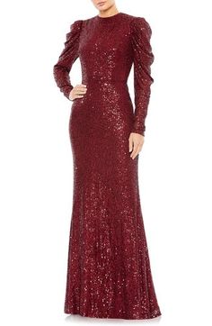 Encrusted with head-to-toe sequins and elevated by Juliet sleeves, this commanding trumpet gown will make you look absolutely regal. 63" length Jewel neck Long sleeves Lined 100% polyester Spot clean Imported Asian Owned/Founded Fitted Long Sleeve Sparkling Gown, Fitted Long Sleeve Gown With Contrast Sequin, Elegant Red Carpet Sequin Dress With Contrast Sequin, Elegant Red Carpet Sequin Dress With Contrast, Fitted Gown With Contrast Sequin For Holidays, Fitted Sequin Evening Dress For Red Carpet, Red Carpet Fitted Evening Dress With Sequins, Fitted Sequin Fabric For Formal Gala, Formal Fitted Sequin Fabric For Gala