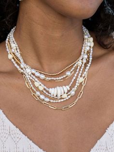 "Beautified with an assemblage of lustrous white freshwater pearl beads, this 18k gold filled pearl necklace alludes to the soothing sands of Hawaii's shores. Wear this gold pearl necklace alone or layered for a classically elegant look. ✦ DETAILS ✦ ✧ Name: Hiwahiwa (HEEvah HEEvah) - precious, beloved, indulged. ✧ Adjustable Length from: 16\"-18\" Inches. ✧ White 3-4mm Freshwater Pearls. ✧ 14kt Gold Filled Components, Extender, and Clasp. ✧ All Ke Aloha Jewelry pieces come packaged thoughtfully, White Multi-strand Pearl Chain Necklace, White Multi-strand Necklace With Pearl Pendant, Pearl Jewelry With Gold Beads For Beach, Beach Pearl Jewelry With Gold Beads, White Pearl Beaded Chain Jewelry, White Pearl Jewelry With Beaded Chain, White Multi-strand Beaded Necklace With Pearl Drop, White Multi-strand Necklace With Gold Beads, White Pearl Chain Jewelry For Beach