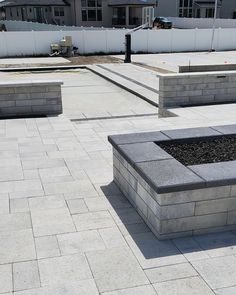 some concrete benches sitting on top of a cement floor