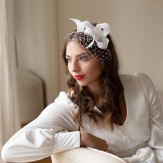 The elegant wedding fascinator adorned with veiling sits on comfortable double headband. The headband is made of millinery wire, firm, but bendable so you can adjust it to your headsize or hairstyle. The headband is wrapped in silk, either in beige or black colour. It can be easily placed to any hairstyle, to loose or short hair. Please, note, the veiling is not shaped as a birdcage.  The headpiece is hand made of premium sinamay using traditional millinery technique.  Colour: ivory If you would Simple Fascinator, Vintage Tea Length Dress, Bow Fascinator, Double Headband, The Birdcage, Mini Hats, Veil Length, Elegant Bridal Gown, Short Veil