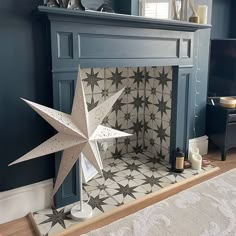 a fireplace mantel with a star decoration on it