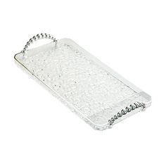 a clear tray with silver beads on the bottom and chain at the top, sitting on a white surface