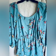 This Babydoll Style Blouse Can Be Worn Either On Or Off The Shoulders, Has Poofy Style Sleeves With Elastic Ends And Look Alike 3 Button Up Front. Nwot And Come From A Smoke Free Home. Color May Vary In Pictures Due To Lighting And Electronic Device. Color Is Blue Flowered Size Is Xl Printed Blue Tops For Daywear, Printed Blue Tops, Blue Printed Tops For Daywear, Blue Floral Print Tops For Loungewear, Blue Spring Loungewear Blouse, Cute Blue Blouse With Floral Print, Brown Long Sleeve Shirt, Babydoll Shirt, White Floral Top