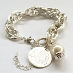 "Monogram Charm Bracelet This statement personalized bracelet is a must have for any fashionista. It is fun and preppy and will work well with your dressy or casual attire. This bracelets comes gift boxed making it perfect for bridesmaids, birthdays, Valentines or any other occasion. Bracelet- 7\" with 1.5\" extender How to Order: 1. Place item or items in cart. (If purchasing more than one item the shipping will automatically be combined. For 5 or more items, contact me for a discounted quote.) Chunky Silver Jewellery, Monogram Bracelet, Silver Link Bracelet, Engraved Pendant, Athens Ga, Chunky Bracelets, Monogram Jewelry, Silver Jewels, Bridesmaid Bracelet