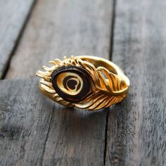 This Beautiful Laser Cut Baltic Amber Peacock Ring Is Crafted From 925 Sterling Silver And Plated With 14k Gold To Create A Truly Unique And Fabulous Piece. Its Adjustable Size Ensures A Perfect Fit For Any Wearer, While The Elegant Design And Stunning Stone Make It A Must-Have For Any Jewelry Lover. Dimensions: 8.8mm X 6.9mm Band Width: 3.6mm Total Weight: 3.11g Handmade In Poland Gold Rings With Peacock Design For Gift, Gold Rings With Peacock Design, Peacock Ring Design Gold, Golden Rings Design For Women, Opal Statement Ring, Safari Wedding, Peacock Ring, Bridal Gift Wrapping Ideas, Jewelry Accessories Ideas