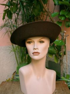 This is a lovely ladies' smart Brown felt hat. It is made in Italy.  The hat is in excellent condition, given the age.  The internal measures are: 18.5 cm. x 18.5 cm. The external measures are: 30 cm. 11 cm tall. Vintage style and refinement! This sweet, soft hat is finished with a brown satin ribbon. International customers: I ship with international registered tracked mail. If you plan to order more than one item, please message me before placing an order, and I can adjust the shipping to refl Retro Cloche Felt Hat For Winter, Retro Winter Cloche Felt Hat, Retro Curved Brim Felt Hat For Winter, Wool Vintage Brimmed Cloche Hat, Vintage Wool Brimmed Cloche Hat, Vintage Wool Top Hat With Wide Brim, Vintage Wide Brim Felt Hat For Winter, Wool Brimmed Evening Hat, Vintage Wide Brim Felt Hat For Evening