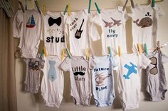 baby ones hanging on clothes line in room