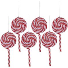 six red and white lollipops hanging from strings