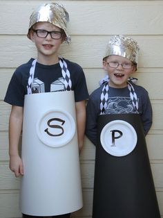 two children wearing costumes made to look like letters