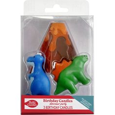 two birthday candles in the shape of dinosaurs, each with a different color and size