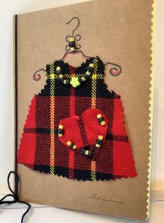 a piece of art made to look like a tartan plaid dress and booties