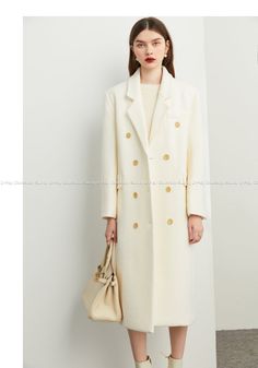 The Tuoo coat offers chic sophistication with its minimalist cream and white color palette for a high-end luxurious look. Crafted from wool, this timeless, elegant coat provides the perfect blend of sophistication, modern yet timeless style and chic comfort. Perfect for any season, this chic design is both stylish and trendy. Luxury Cream Outerwear With Double Button Closure, Cream Wool Coat For Business In Winter, Winter Business Cream Wool Coat, Business Cream Wool Coat, Elegant Cream Wool Coat With Notch Lapel, Chic Beige Wool Coat With Lapel Collar, Luxury Single Breasted Beige Wool Coat, Elegant Long Wool Coat With Double Button Closure, Luxury Beige Single Breasted Wool Coat