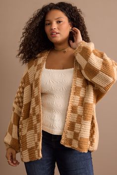 Wrap yourself in cozy style with this chunky cardigan featuring a delightful checkered pattern. The balloon sleeves add a touch of whimsy to your look, making it perfect for any occasion. Made from soft and warm material, this cardigan ensures you stay comfortable. Chunky Cardigan Outfit, Different Body Sizes, Checkered Cardigan, Layering Essentials, Outfit Looks, Crewneck Sweaters, Wedding Branding, Free Jeans, Cozy Style