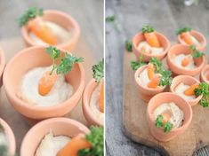 small cups filled with food sitting on top of a wooden cutting board