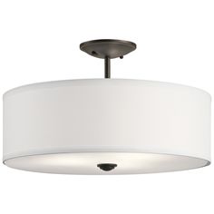 a white drum light hanging from a ceiling fixture