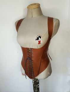 Hello. This is Aylin, The creator of the Supermoonax brand.  I design and produce all the products on my page.  I took all the photos.  I would like to try to deliver the products to you in the best  Corset and cuffs set *Its adjustable size +-7 cm/3  inches with ropes *Corset made as narrow as 10 percent of your waist measurement *Any size avaliable *Arrival to Europe and UK 3 , USA in 5 days with free express shipping. *Real leather product (soft lambskin) It is soft corset,  have plastic bone Fantasy Overbust Corset Belt For Larp, Gothic Corset With Boning For Cosplay, Steampunk Leather Corset For Cosplay, Steampunk Underbust Corset Belt For Fantasy Events, Fitted Leather Corset For Cosplay, Fantasy Underbust Corset Belt For Larp, Steampunk Fitted Corset Belt For Festivals, Steampunk Corset For Festival, Fitted Leather Corset With Corset Back