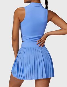 This 2-piece tennis skirt set features a V-neck polo top and a high-waisted pleated skirt for a sporty, cute look. Crafted from ultra-soft, breathable fabric, it offers comfort and freedom of movement, complete with built-in shorts for coverage. Perfect for tennis, golf, or casual wear—add both pieces to your cart to complete the look!   Feature   Top:   V-neck polo collar   Sleeveless design   Removable cup pads   Skirt:    High waisted waistband   Irregular pleated hem   Built-in shorts   Inne High Waisted Pleated Skirt, Yoga Day, Sport Bra Top, Polo Top, Skirt Sets, Collar Top, V Cuts, Freedom Of Movement, Tennis Skirt