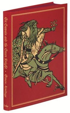 a red book with an image of a man riding on the back of a horse