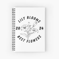 a spiral notebook with the words lily blooms best flowers on it in black and white