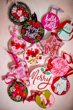 a bunch of decorated christmas ornament hanging on a wall