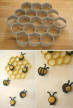 some paper honeycombs are hanging on the wall and one is made out of bees