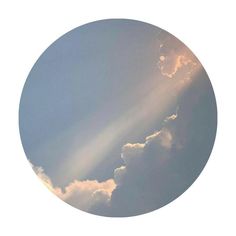 an image of clouds in the sky with sun rays coming out from behind one cloud