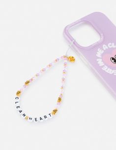 a phone case with a beaded lanyard on it