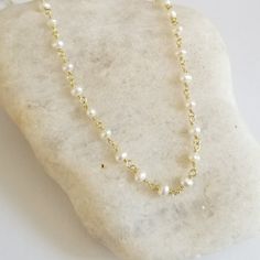 Dainty and oh so pretty, this Freshwater Pearl necklace makes a great everyday boho choker and is ideal for layering with other necklaces in your collection. Available in standard choker length which is 14 inches and sits up high at the neck or your choice of other longer lengths as well.Crafted in natural Pearls. Solid lobster clasp. Pearls are about 3 to 4 mm in size.Details:* Tiny Natural Pearls Rosary Chain* Wire is Sterling Silver with a Rhodium Plating or Gold Version is Sterling Silver wi Pearl Rosary, Spiritual Crystals, Boho Choker, Rosary Chain, Freshwater Pearl Necklace, Necklace Beaded, Purple Crystals, Freshwater Pearl Necklaces, Beaded Choker