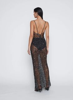 Heightened tactility and luminous surface is combined to form this sleeveless sequin maxi dress. Its elongating column silhouette is framed with fine satin straps. Artfully constructed from a sheer sequin netting that sculpts the body, hand beaded to catch the light from all angles. Due to the delicate nature of this dress; it is final sale. Sequin Maxi Dress, Sequin Maxi, Knitwear Tops, Black Sequins, Hand Beading, Holiday Dresses, Occasion Dresses, Scoop Neckline, Spaghetti Strap