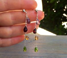 Handmade, gemstone Cascade earrings in Sterling silver, posts, wire wrapped, purple Amethyst, deep red Garnet, yellow Citrine, green Peridot. Genuine, untreated gemstones are faceted teardrops, about 6x8 mm each. These dangle, delicate earrings measure 3 inches long. These earrings can be made in different metal finishes, with different stones ( I have s huge selection of gems and crystals), or with different kind of earwire. The earrings will come in a complimentary, beautiful jewelry box ready Peridot Jewelry, Yellow Citrine, Green Peridot, Studio City, Cluster Earrings, Delicate Earrings, Red Garnet, Purple Amethyst, Gemstone Colors