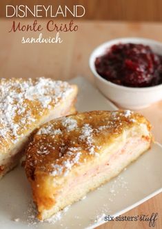 two pieces of bread on a plate with cranberry sauce