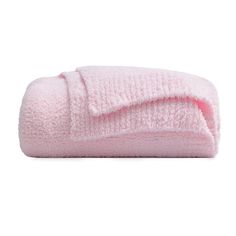 a pink towel folded on top of a white surface