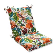 an outdoor chair cushion with colorful flowers and leaves on the front, attached to a white background