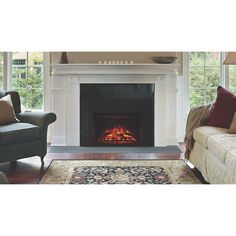 a living room filled with furniture and a fire place in the middle of the room