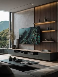 a living room filled with furniture and a large flat screen tv mounted on the wall