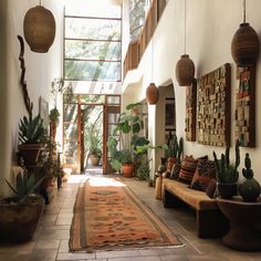 a hallway with plants and potted plants on the wall, along with an area rug