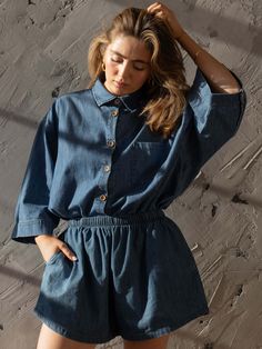 Meet our best-selling Linen Shirt, now in soft, denim chambray! This relaxed-fit button down-shirt for women has wide sleeves and a boxy fit that makes it the perfect everyday piece for the warm weather. We love it paired with The Chambray Denim Short or The Wide Leg Jean.Our small-batch wash process means that each of our denim garments will vary slightly in color and appearance.• Composition: 100% cotton• Available in: MID DENIM• US sizes: XS (US 0–2), S (US 4–6), M (US 8–10), L (US 12–14), XL Light Wash Chambray Button-up Denim Top, Dark Wash Chambray Button-up Denim Top, Chambray Denim Top With Pockets, Short Sleeve, Medium Wash Chambray Button-up Shirt, Chambray Denim Shirt, Medium Wash Chambray Denim Button-up Top, Jumpsuit Jacket, Chambray Shirt, Wide Sleeves