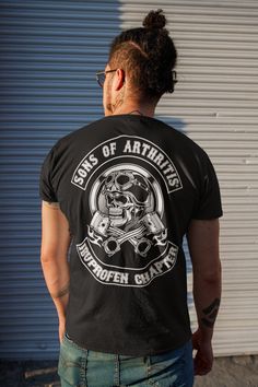 "The one and only Sons of Arthritis® is a registered brand. When you buy from us you know you are getting the authentic shirts that started a revolution in the biker community. Don't trust the copycats out there. There is only one true Sons of Arthritis LLC. www.sonsofarthritis.com When you're a biker at heart despite the fact that every bone in your body hurts due to age. This funny shirt is perfect for you! You can purchase and make it as a gift for Father's Day. ABOUT OUR TEES 👕 Our unisex t Biker Style Cotton T-shirt With Screen Print, Punk Style Crew Neck T-shirt For Biker Events, Screen Print Tops For Biker Events, Biker Style Crew Neck Shirt For Streetwear, Cotton Biker Top For Biker Events, Biker Style T-shirt With Front Print For Biker Events, Biker Style Cotton Shirt For Streetwear, Punk Style Short Sleeve T-shirt For Biker Events, Cotton Biker Shirt For Biker Events