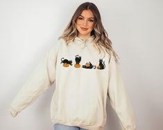 Halloween Black Cat Design Sweatshirt, Black Cat Sweater, Halloween Gifts for Cat Owner, Cat on Pumpkin Hoodie, Black Cat Sweatshirt We're here to give you the best sweatshirt and hoodie options for you. We want to make everyone smile with our cute, stylish and trendy graphic sweatshirts and hoodies. We can assured you this sweatshirt or hoodie will be perfect gift whether you will buy it yourself or for someone else. PLEASE ATTENTİON We use black design for Sport grey, white and sand; white des Fall Cat Print Hoodie Sweatshirt, Cat Print Hoodie Sweatshirt For Fall, Fall Cat Design Hoodie Sweatshirt, Cat On Pumpkin, Pumpkin Hoodie, Black Cat Design, Design Sweatshirt, Cat Sweater, Halloween Black Cat