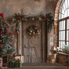 christmas decorations and presents are arranged in front of a wooden door with an arched window