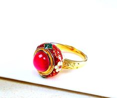 New Model! Golden plated Ring Red  Gem Handmade. Adjustable Ring jewelry Multi Coloured Cloisonne enameled.  High quality.    Handmade ethnic antique design egyptian style ring Metal Type - 18k Gold plated Gem Colour - Red The rings are delivered with a jewelry box.  Combined shipping! Traditional Red Enamel Jewelry, Traditional Red Ruby Ring For Gift, Traditional Round Enamel Ring As Gift, Traditional Round Enamel Ring Gift, Traditional Red Ruby Ring, Traditional Red Ceremonial Rings, Unique Red Enamel Ring As Gift, Unique Red Enamel Ring As A Gift, Unique Red Enamel Ring For Gift