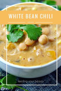 white bean chili in a bowl with cilantro and parsley garnish