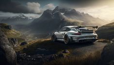 a white sports car parked on top of a mountain