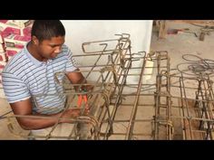 a man is working on some kind of cage