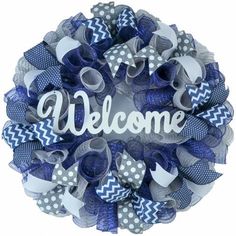 a blue and white wreath with the word welcome on it