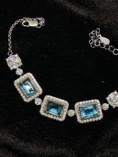 Certified Genuine Natural 7+ct Swiss Blue Topaz Gemstones in Emerald Cut 18K White Gold Vermeil Solid 925 Sterling Silver Elegant Bracelet Stones 8x6mm each Size - One Size Fits Most - 6 - 7.25" inches Please see my other listing Thank you for supporting my small business!! 😍😍 Welcome in!  Wholesale Prices on Certified Genuine Precious, Semi-Precious Gemstones & Vintage Jewelries!  Please shop my other listing Been in Business for over 20+ years, Fairly New on Etsy! Elegant Aquamarine Silver Bracelets, Elegant Aquamarine Bracelet Jewelry, Elegant Blue Aquamarine Bracelets, Exquisite Blue Topaz Jewelry, Exquisite Blue Topaz Jewelry In Blue, Elegant Formal Topaz Bracelets, Elegant Formal Topaz Bracelet, Luxury Aquamarine Jewelry With Diamond Accents, Luxury Sterling Silver Bracelet With Cubic Zirconia Gemstone