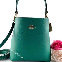 100% Authentic Brand New With Tag Sold Out In All Stores Excellent Gift - Includes Gift Bag Nwt Coach Small Town Bucket Bag In Beautiful Jade Color Soft Leather With Pink Interior. [Bag] Color: Gold/Bright Jade Double Face Leather Center Zip Compartment Snap Closure Handle With 6 3/4" Drop Detachable Strap With 22" Drop For Shoulder Or Crossbody Wear 8 1/2" (L) X 8 3/4" (H) X 4" (W) Includes:Coach Price Tag,Care Card & Gift Bag Fast Shipping Smoke-Free Home Formal Green Coach Bag, Green Formal Bucket Bag, Formal Green Coach Shoulder Bag, Green Coach Shoulder Bag For Formal Occasions, Coach Green Shoulder Bag For Formal Occasions, Coach Green Bag With Gold-tone Hardware, Elegant Green Crossbody Bucket Bag, Chic Green Coach Bag, Coach Green Shoulder Bag With Gold-tone Hardware