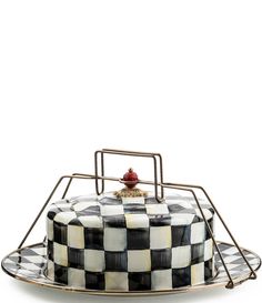 a black and white checkered cake on a plate