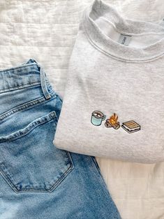 S'mores Trio Embroidered Crewneck - Etsy Embroidery Crew Neck Ideas, Cute Vintage Sweatshirts, Machine Embroidery Designs For Sweatshirts, Cute Fall Sweatshirt Designs, Fall Crewneck Sweatshirt Embroidery, Cute Sweatshirts For Women, Cute Fall Sweatshirts, Cosmetology Clothes, Sweatshirt Product Photography