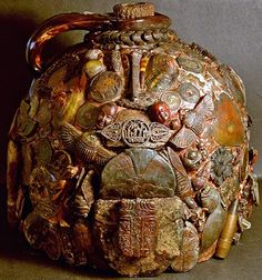 an elaborately decorated vase is shown on the table